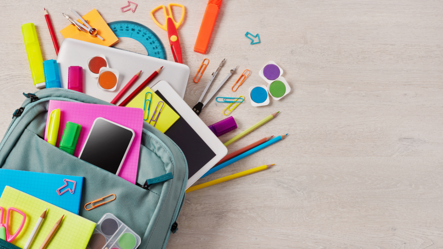 A backpack with school supplies spilling out